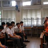 Visually impaired public education ambassador sharing with students at school