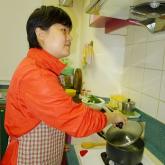 a visually impaired person is cooking