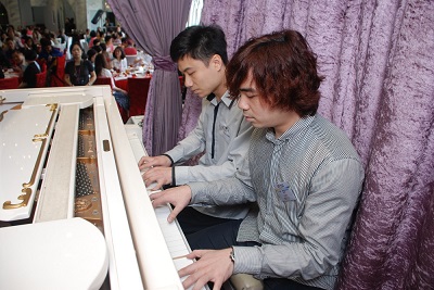 Visually impaired pianists Lee Hin (left) and Lee Sing (right) gave a piano duet