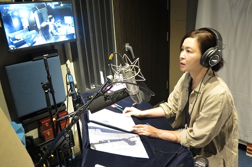 Ms So Yuk Wa recording the audio description sound track