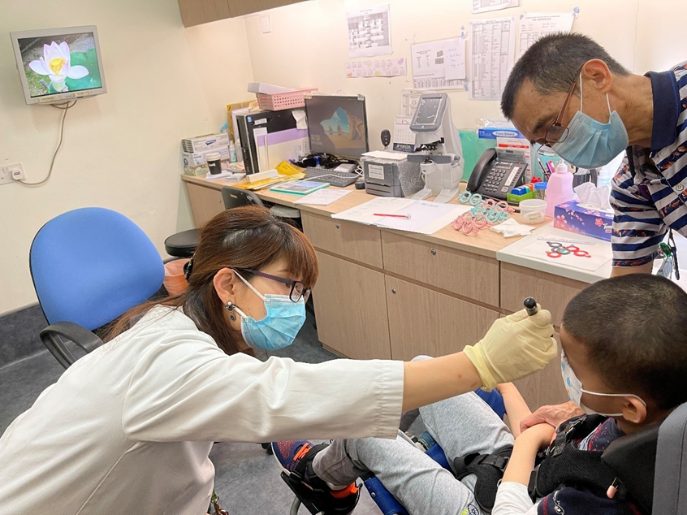 optometrist conducting vision screening for a child