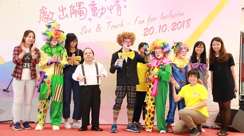 Johnny Tsang, Artist with Disability (left four) playing harmonica and the Happy Clown magic performance  