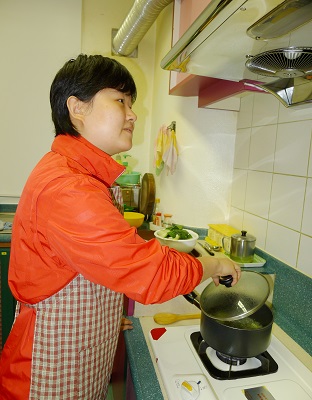 a visually impaired person is cooking