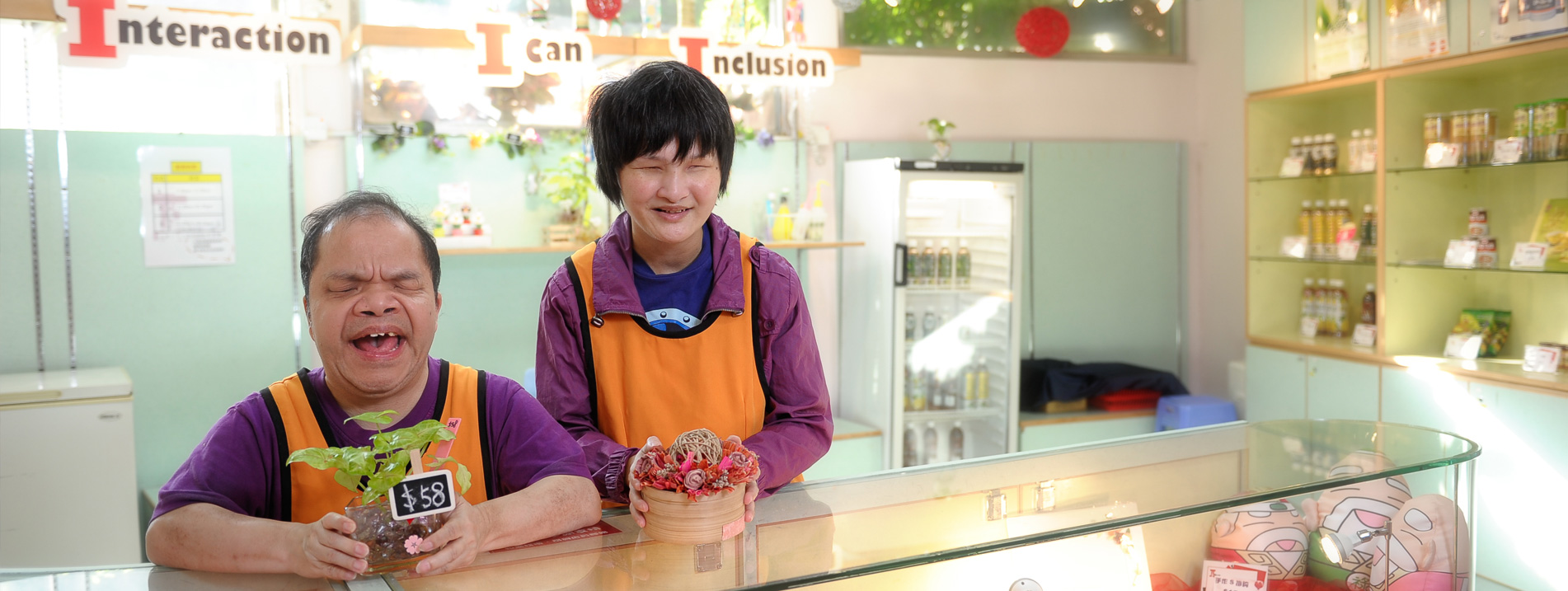 Two trainees with multiple disabilities at I-Shop